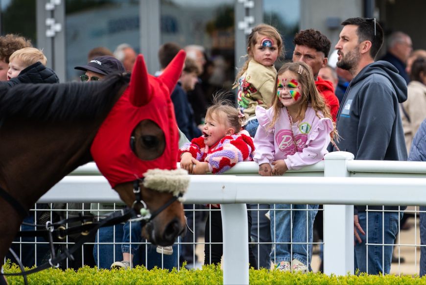children watching a horse
